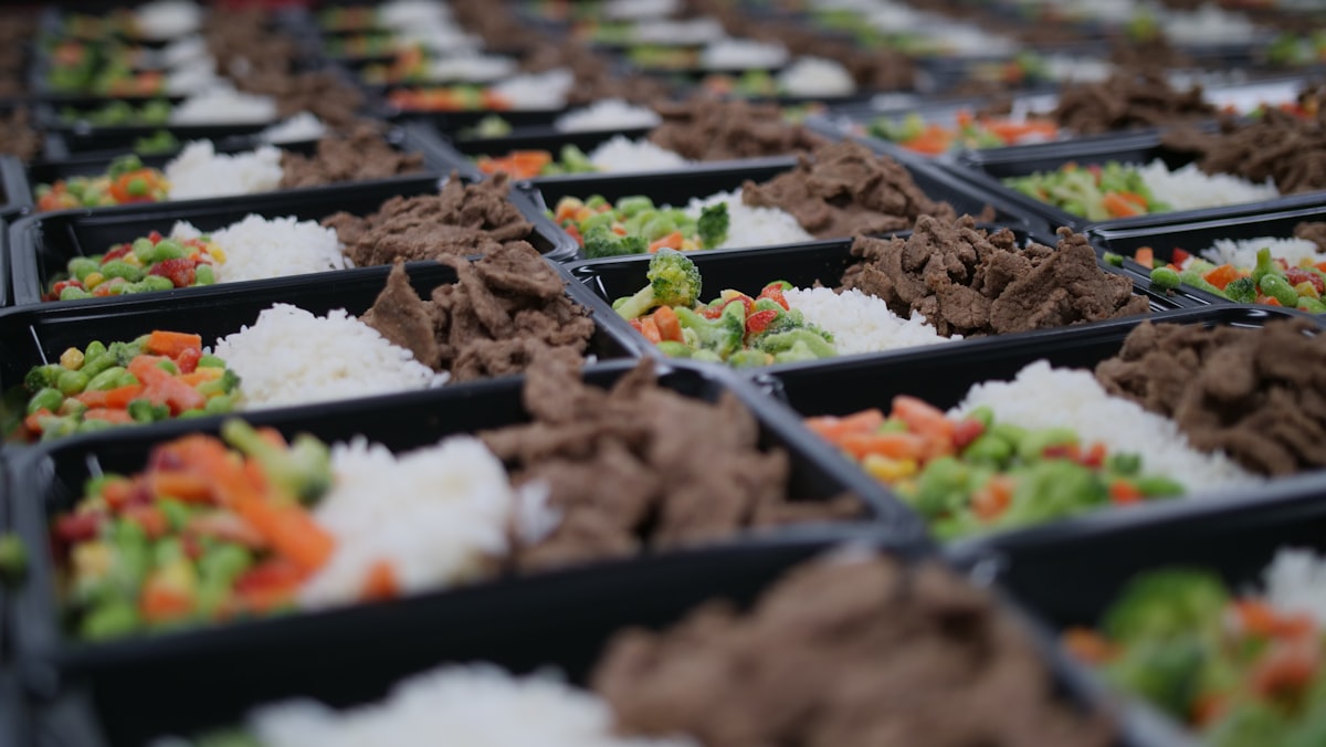 Stacked meal prep containers with organized portions